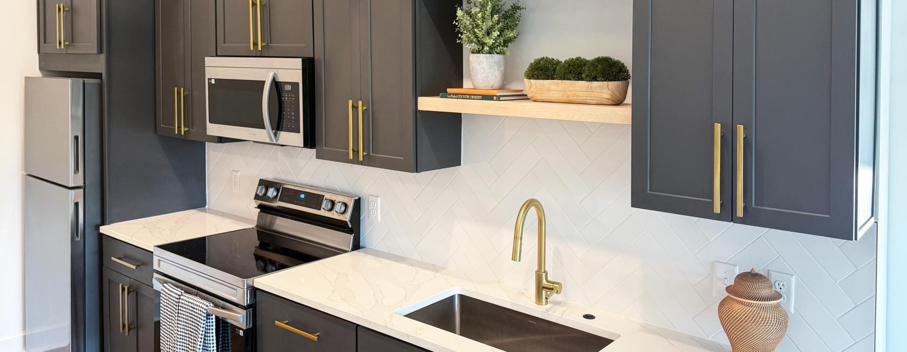 a kitchen with black cabinets