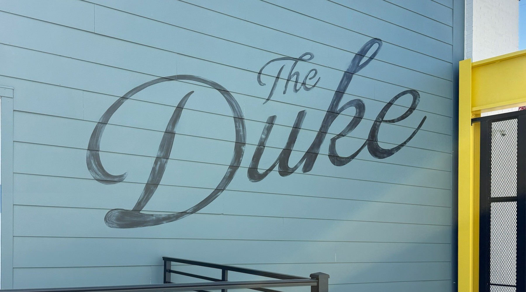 a wall with writing on it