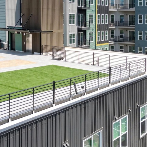 a building with a green rooftop lawn